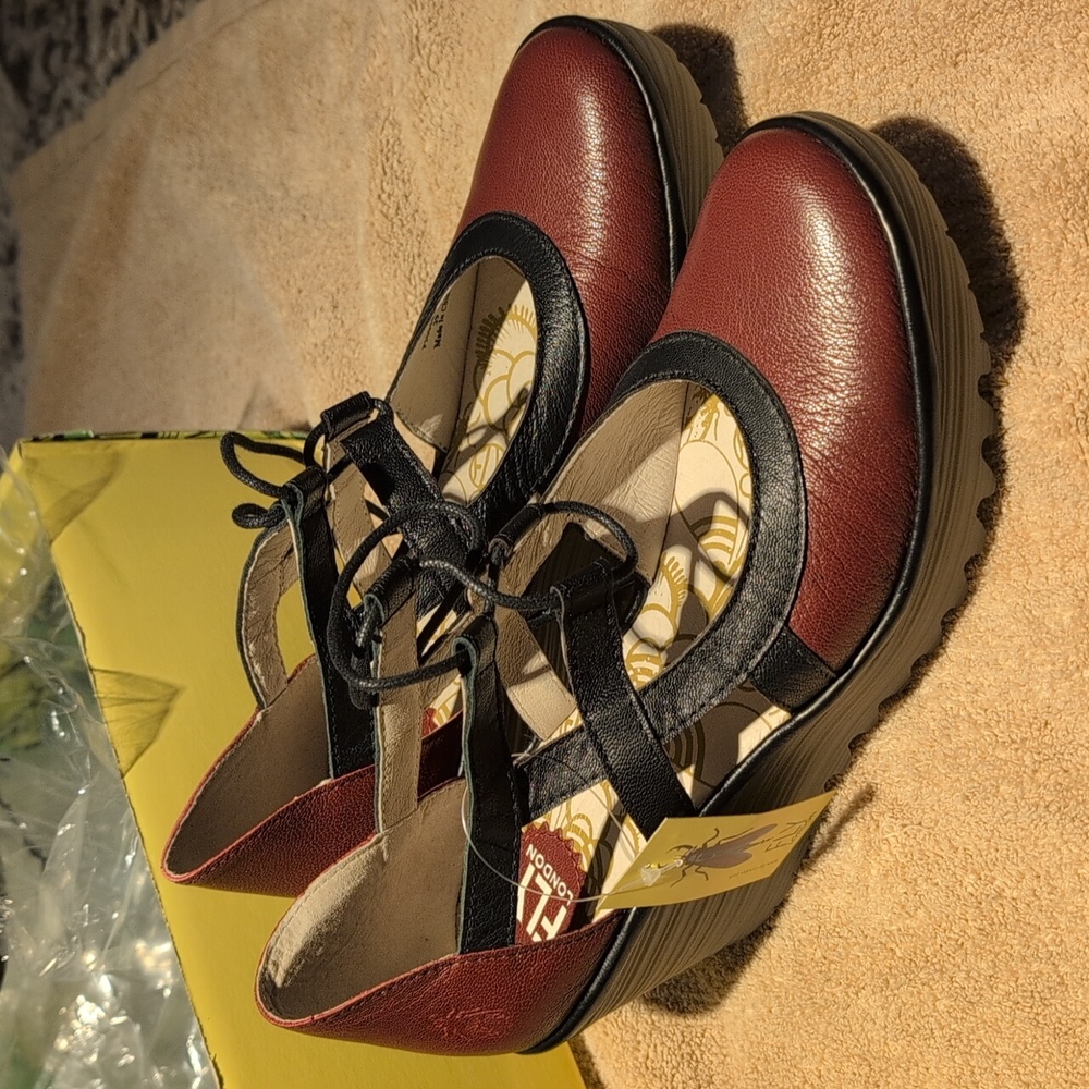 Fly London Yellow Shoe Box with Black Text